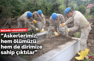 Askerler, selde zarar gören mezarlıkları temizledi